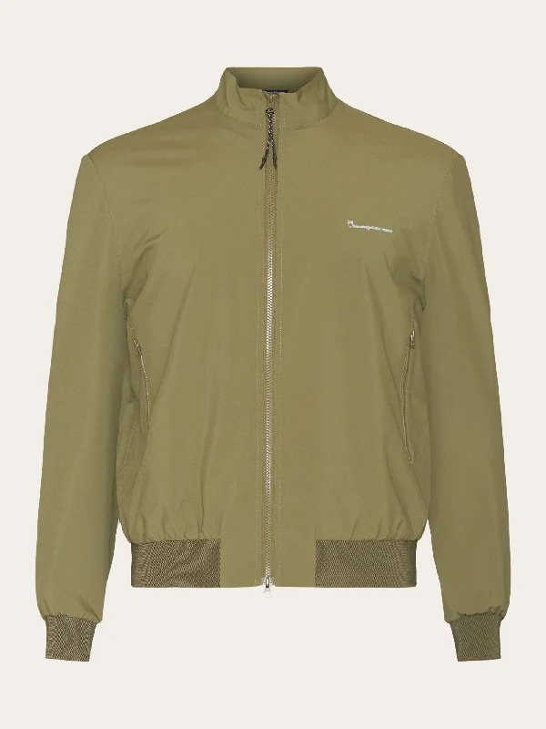 Men's hiking jacket-Men's ultra-breathable gym t-shirt-NORDENVIND™ Light shell bomber jacket - GRS/Vegan - Burned Olive